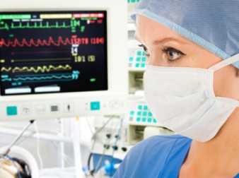 Doctor with surveillance monitor