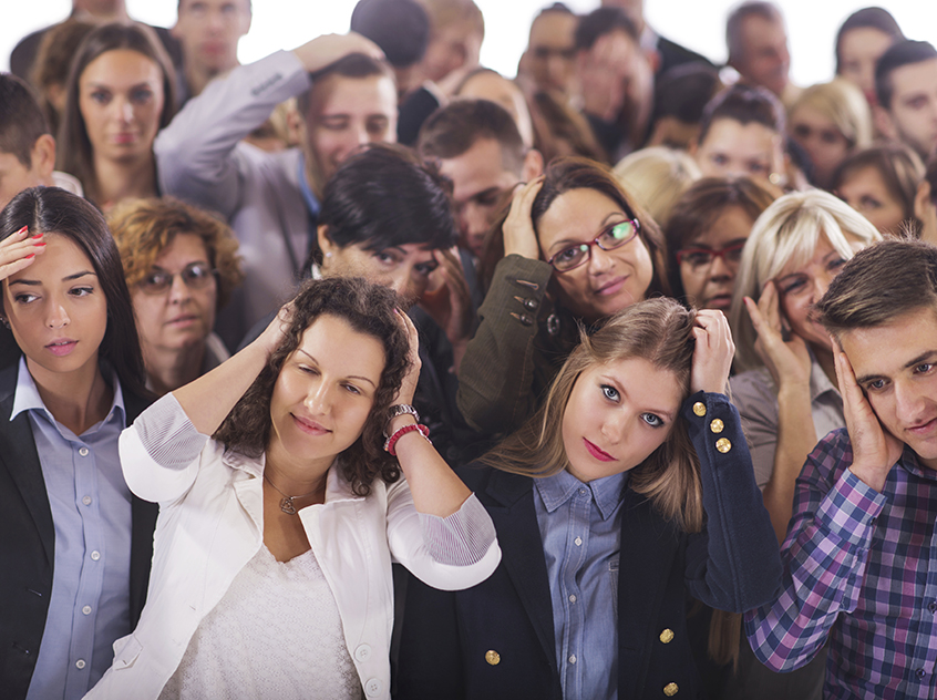Large group of business people having a headache.